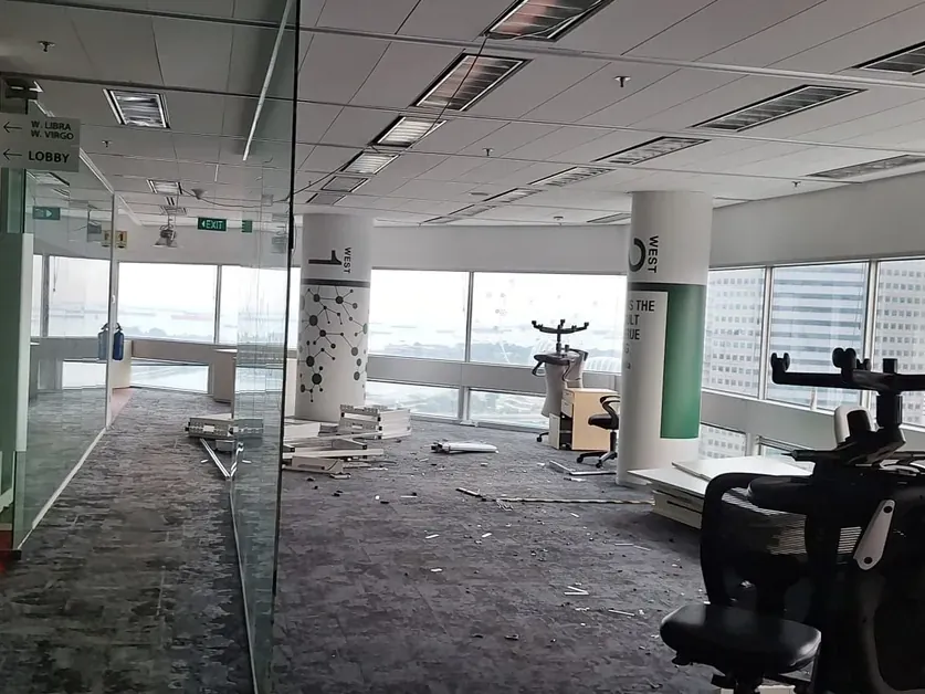 Wide view of a stripped-out office floor close to landlord handover